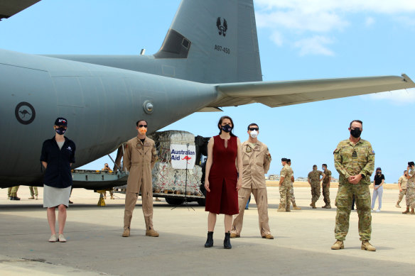 Australian embassy and ADF personnel in front of an ADF C-130 delivery of humanitarian assistance to Lebanon after the Beirut port blast.