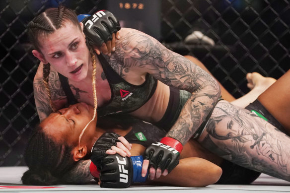 Megan Anderson (top) and Zarah Fairn compete during UFC 243.