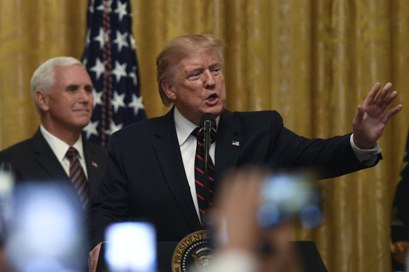 US President Donald Trump, flanked by Vice President Mike Pence. 