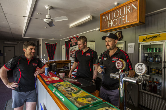 Yallourn North Bombers players Elliott DeCarli , Campbell MacInnes and Barrie Burnett in their club rooms. EnergyAustralia has been a major sponsor for the Yallourn North Football Netball Club. 