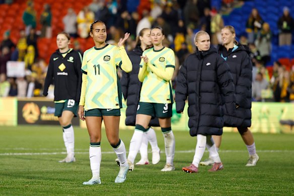 Mary Fowler and teammates at fulltime in Newcastle on Saturday night.