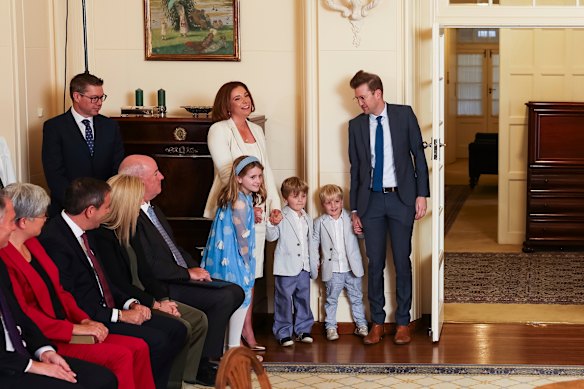 Anika Wells and her children watch the proceedings.