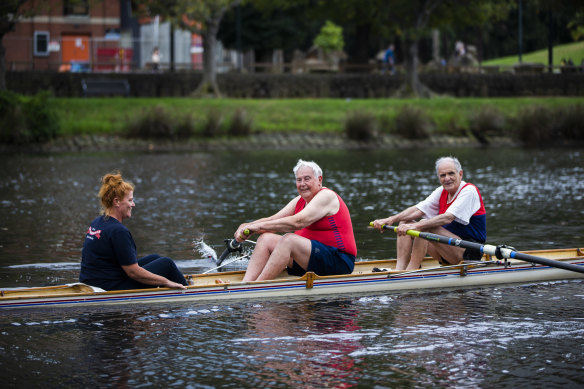 Go with the flow: Jim Skidmore, 82, and Peter Gill, 80, of Yarra Yarra Rowing Club, with Jim’s daughter, Linda Skidmore, who is club president. 