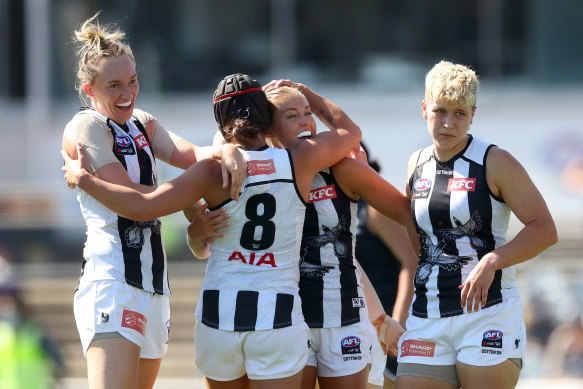 Sarah Rowe celebrates a goal with teammates.