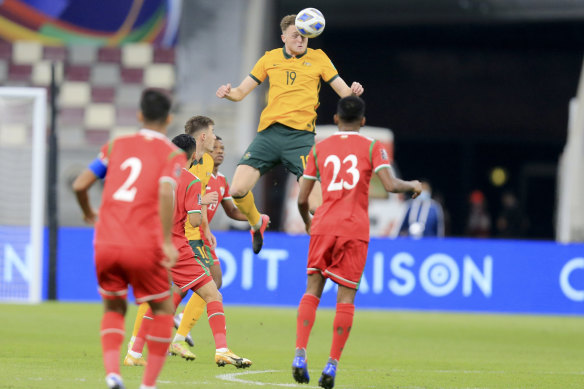Harry Souttar connects with a header during Australia’s win over Oman.