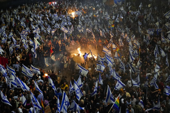 Israelis opposed to Prime Minister Benjamin Netanyahu’s judicial overhaul plan set up bonfires and block a highway during a protest in Tel Aviv after the Israeli leader fired his defence minister.