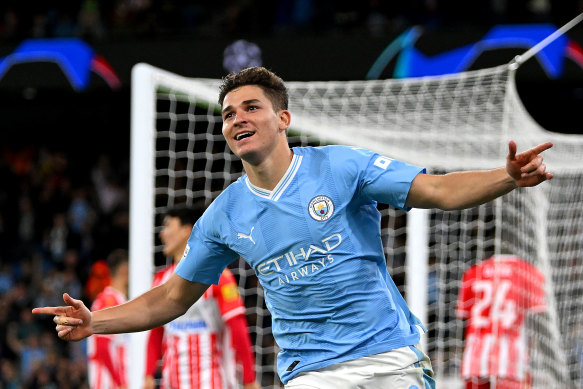 Alvarez celebrates after putting the ball into the back of the net for Manchester City.