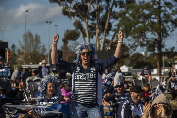Cats fans enjoy the grand finals victory outside of Kardinia Park.
