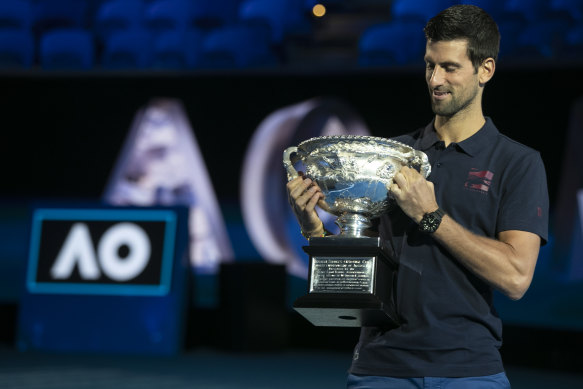 Novak Djokovic with his seventh Australian Open title last year.