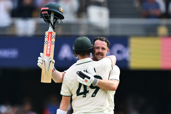 Travis Head celebrates his century in now familiar style with Steve Smith.