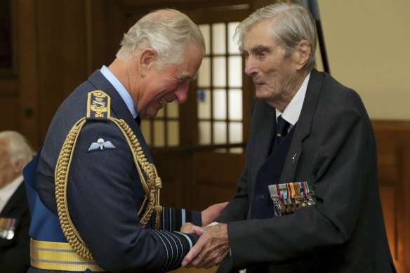 Prince Charles shakes hands with Battle of Britain pilot Paul Farnes in 2017.