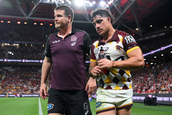 Kotoni Staggs leaves the field for the Brisbane Broncos against the Dolphins.