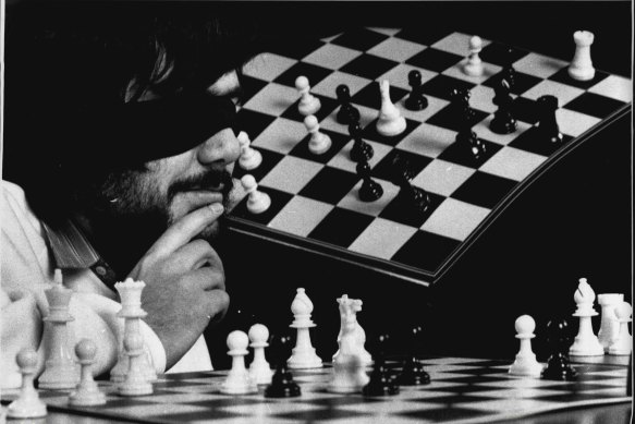 Australia's first Grandmaster Ian Rogers plays in an exhibition match (beating four plays while blind folded) in 1989.