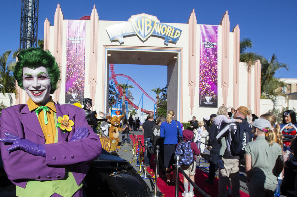 A performer welcomes guests at Warner Bros Movie World in July.