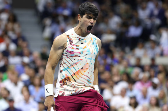 US Open defending champion Carlos Alcaraz roars during his straight-sets win over Lloyd Harris.