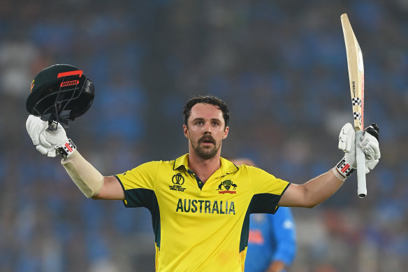 Travis Head celebrates his century in the World Cup final.
