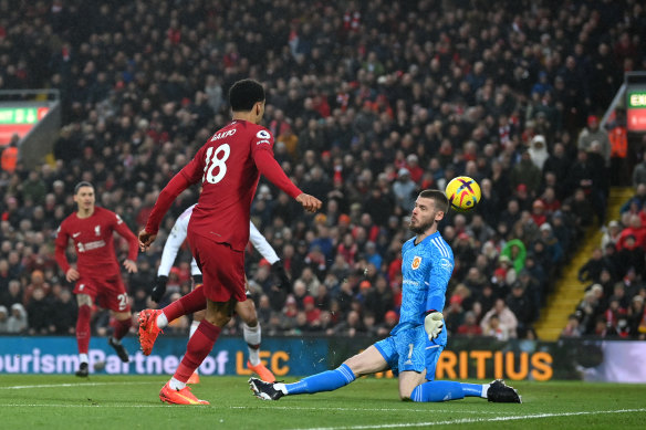 Cody Gakpo chips the ball past David De Gea for Liverpool’s third.
