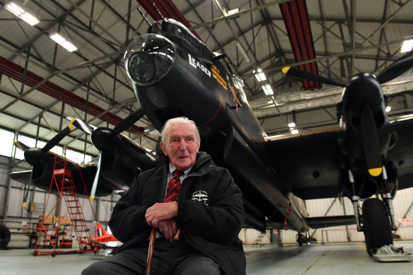 Johnny Johnson, the last survivor of the original Dambusters of 617 Squadron, sits beneath an Avro Lancaster bomber at RAF Coningsby, Lincolnshire. 