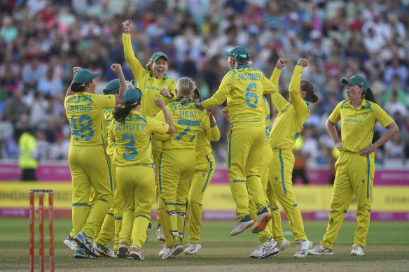 Australia players celebrate winning the gold medal in the cricket final at the Birmingham Commonwealth Games in 2022.