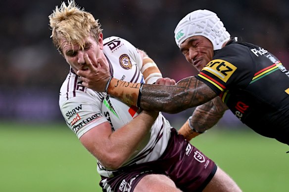 Panthers winger Brian To’o sinks his claws into Manly’s Ben Trbojevic.