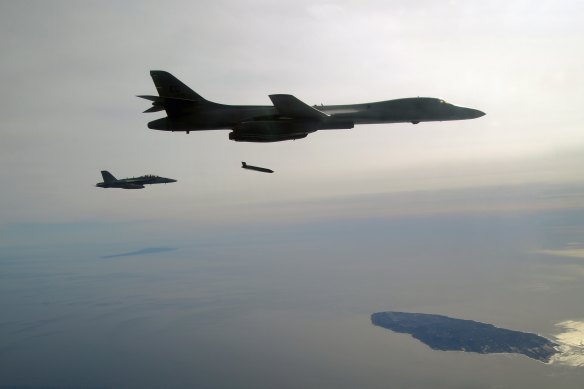 A US Air Force plane releases a Long Range Anti-Ship Missile (LRASM) during a test event. Australia is planning to buy 200 missiles to arm its air force.