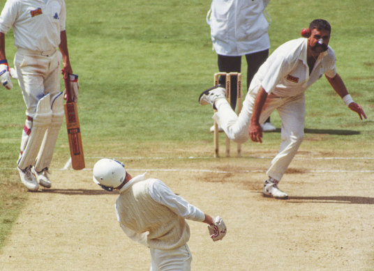 Merv Hughes strikes Mike Atherton with a short ball during the 1993 Ashes.