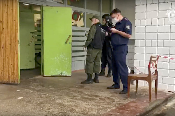 Investigators at the scene of the school shooting. 