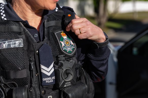 Two police officers have been stood down and charged over an incident at Ashgrove in August.