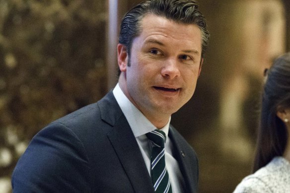 Pete Hegseth walks to an elevator for a meeting with President-elect Donald Trump at Trump Tower in 2016.