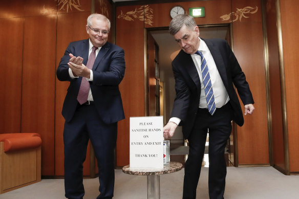 Scott Morrison and Brendan Murphy sanitise their hands before a national cabinet meeting.