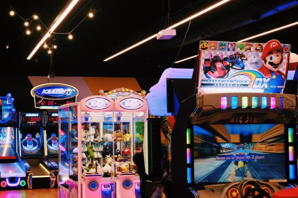 The lurid colours of the arcade in central Cairns are an abrupt change from the cane fields.