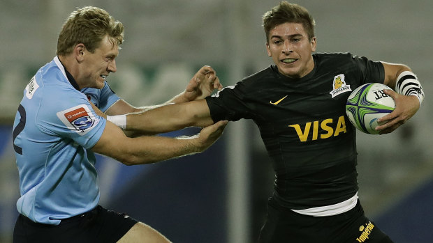 Hand-off: Bryce Hegarty fails to stop Jaguares fullback Sebastian Cancelliere making a break.