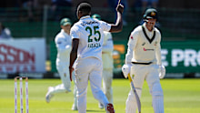 South Africa’s Kagiso Rabada, centre, celebrates the wicket of Australia’s Nic Maddinson, right, on day four.