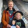 David Mence and his son Leonard with a photo of David’s father Ian.
