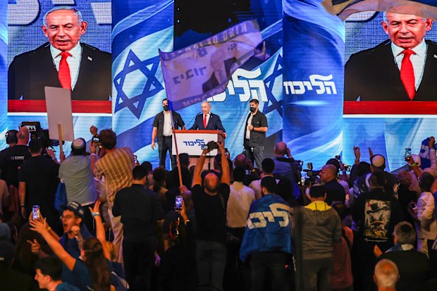  Israeli Prime Minister and Likud party leader Benjamin Netanyahu speaks to supporters at the Likud Party election-night event at the Teddy Hall