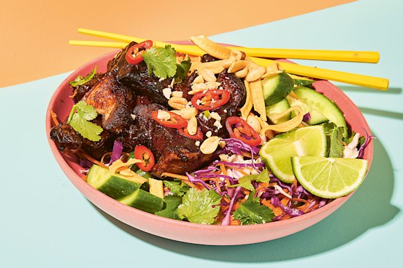 A crisp, brightly flavoured Asian salad complements sticky pork belly cubes.