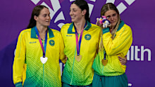 Silver medallist Alex Perkins, gold medallist Meg Harris and bronze medallist Shayna Jack.
