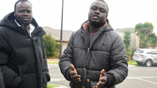 Elbino Akueng, right, pleads for justice after his 15-year-old son, Dau Akueng, was stabbed to death in Cobblebank.