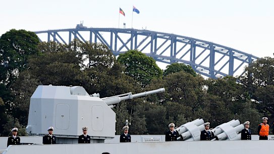 Chinese Navy personnel are seen on board a Chinese warship which arrived at Garden Island Naval Base in Sydney on Monday.
