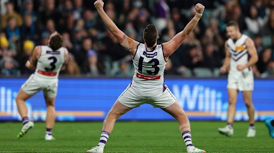 ADELAIDE, AUSTRALIA - AUGUST 09: Luke Ryan of the Dockers celebrates the win on the siren during the 2025 AFL Round 22 match between the Port Adelaide Power and the Fremantle Dockers at Optus Stadium on August 9, 2025 in Adelaide, Australia. (Photo by Sarah Reed/AFL Photos via Getty Images)