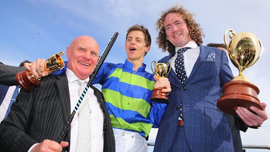 Colin McKenna, left. with jockey Nick Hall and trainer Ciaron Maher after winning the 2016 Caulfield Cup.