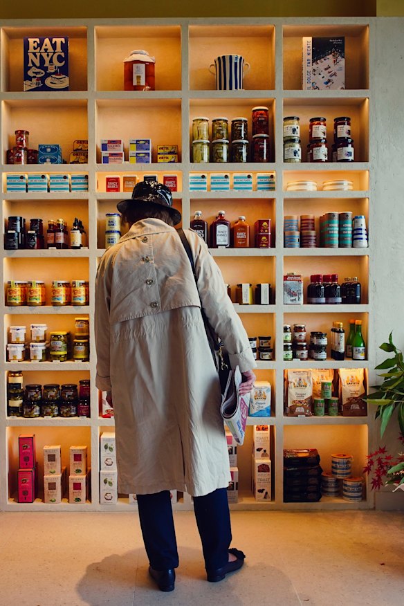 A shopper peruses the produce at Breadcetera.