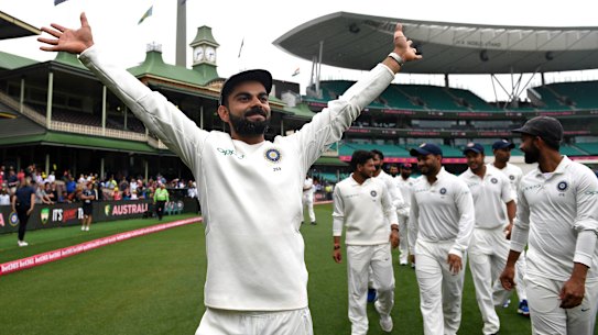 Virat Kohli gestures to supporters as India celebrate a 2-1 series victory over Australia.