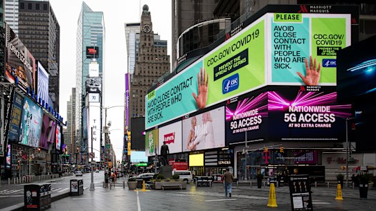 The Times Square neighbourhood of New York is quiet on Thursday as the city is ordered to stay home.