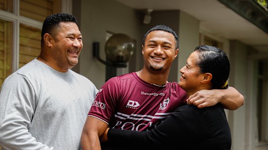 Latu Fainu with parents Lile and Chris.