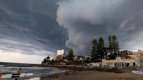 A storm rolls into Cronulla beach, where the Reserve Bank expects climate change is