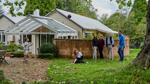 Happy home: children Manning and Audrey with mother Zoe Flanagan-Field, Zoe’s parents, Robin and Warwick Mosman, and father Craig Field, outside the home they share in the Blue Mountains.