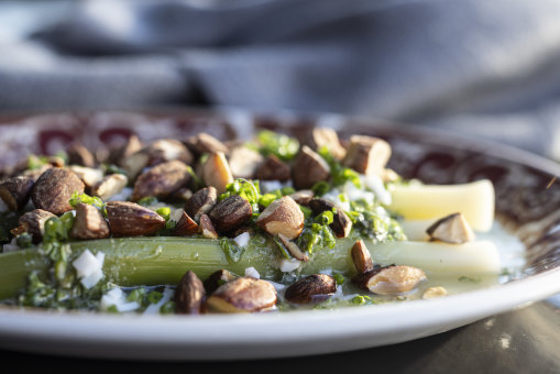 Cold, poached baby leeks with boiled egg, smoked almonds and a tarragon vinaigrette is pure retro charm.