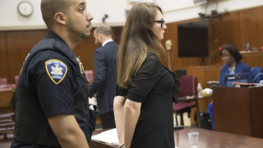 Court officers escort Anna Sorokin from the courtroom in New York during trial.