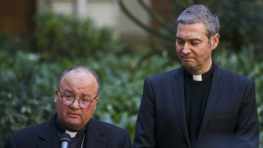 Archbishop Charles Scicluna, left, and Spanish Monsignor Jordi Bertomeuof, right, take part in a press conference at the Catholic University of Chile, in Santiago, Chile.
